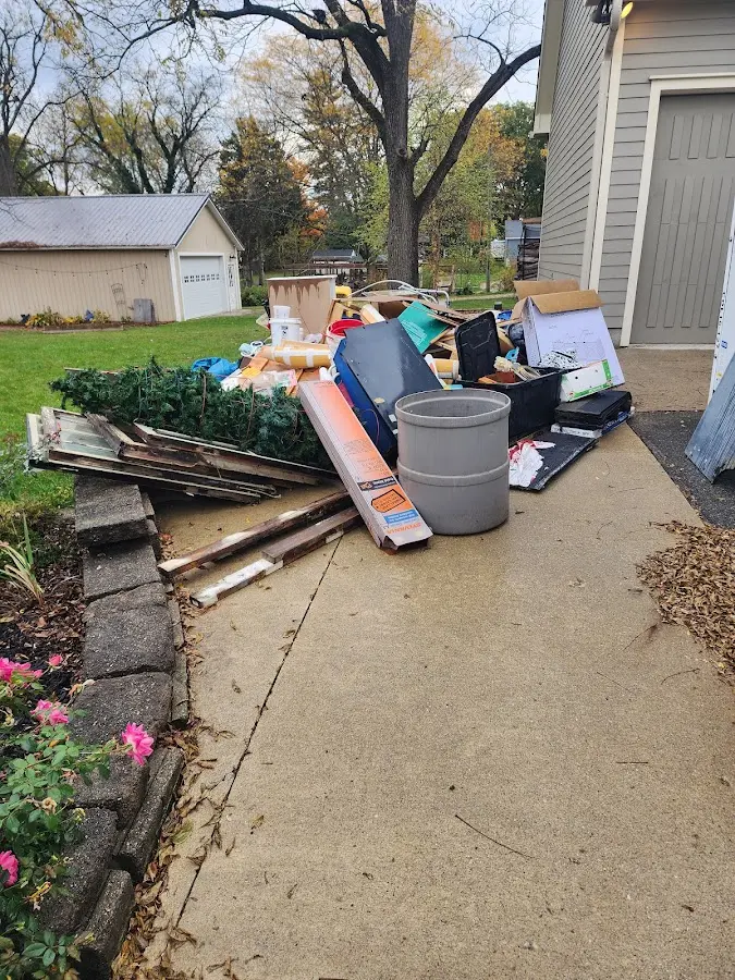 Dumpster being loaded with debris for Residential Dumpster Rental in Cranford